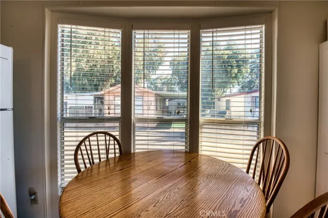 a view of room with window and wooden floor