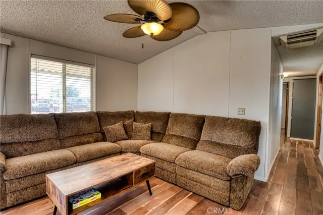 a large bed in a room next to a window