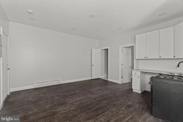 a kitchen with stainless steel appliances granite countertop a stove and a refrigerator