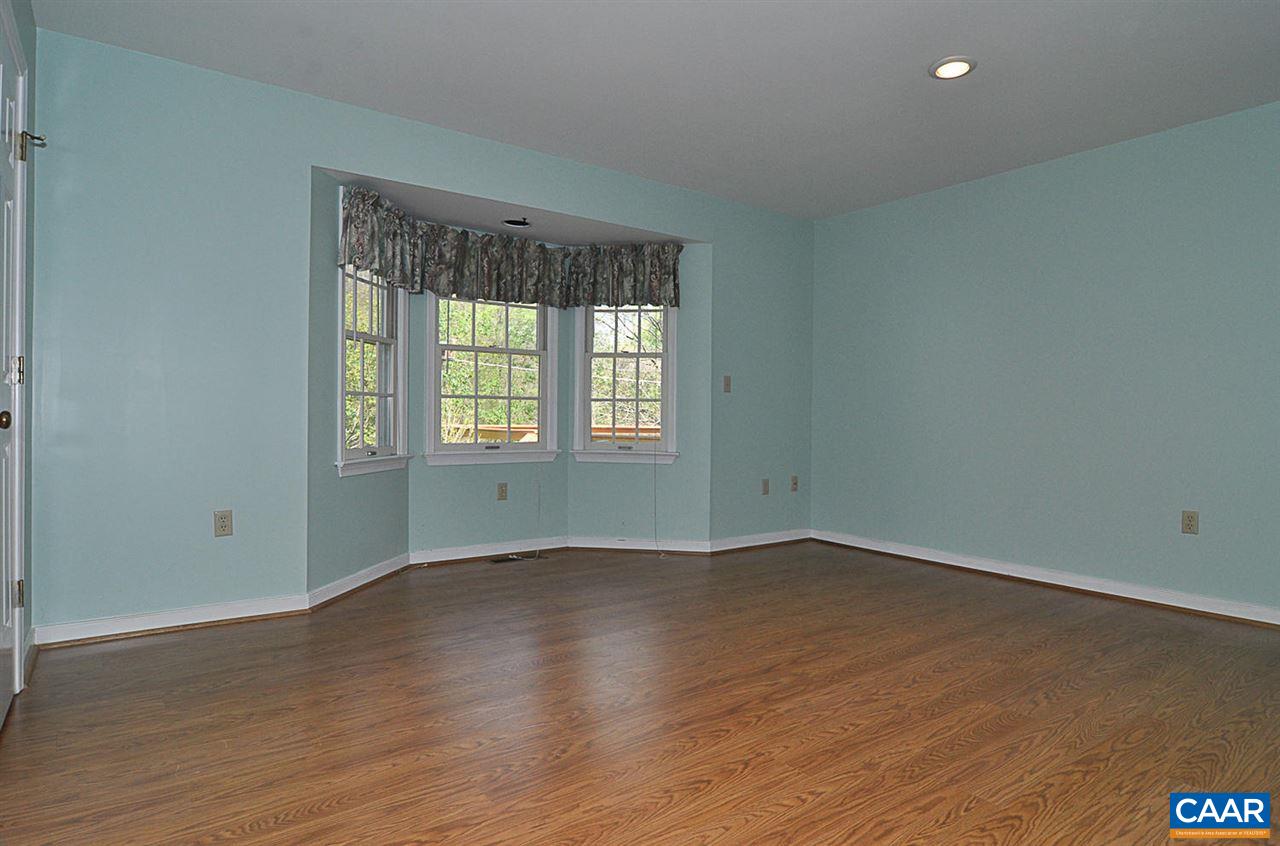 1576 Old Brook Road Charlottesville, VA 22901 - Photo 12 of 42 an empty room with wooden floor and windows