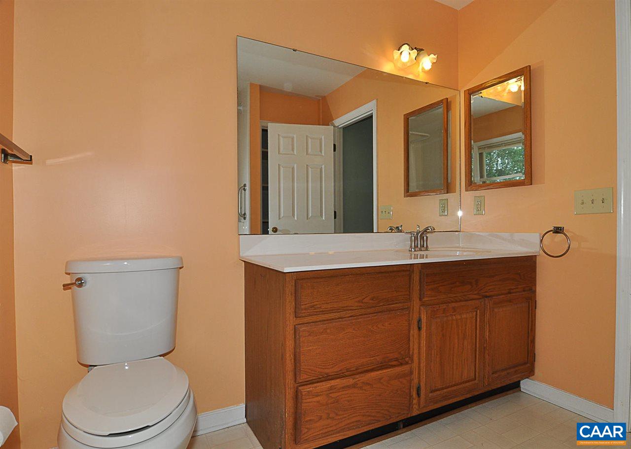 1576 Old Brook Road Charlottesville, VA 22901 - Photo 19 of 42 a bathroom with a toilet sink and mirror