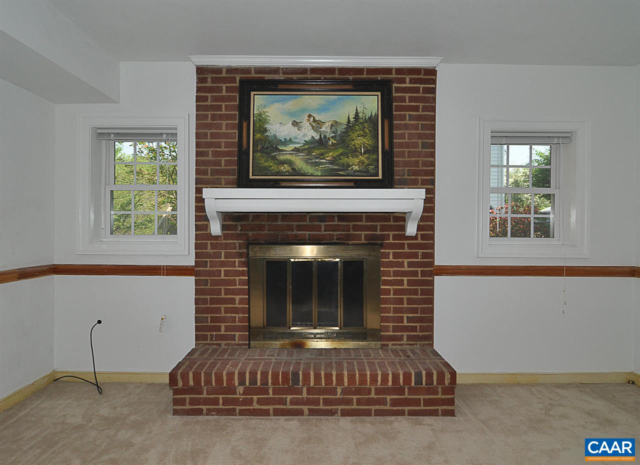 1576 Old Brook Road Charlottesville, VA 22901 - Photo 27 of 42 a living room with furniture and a fireplace