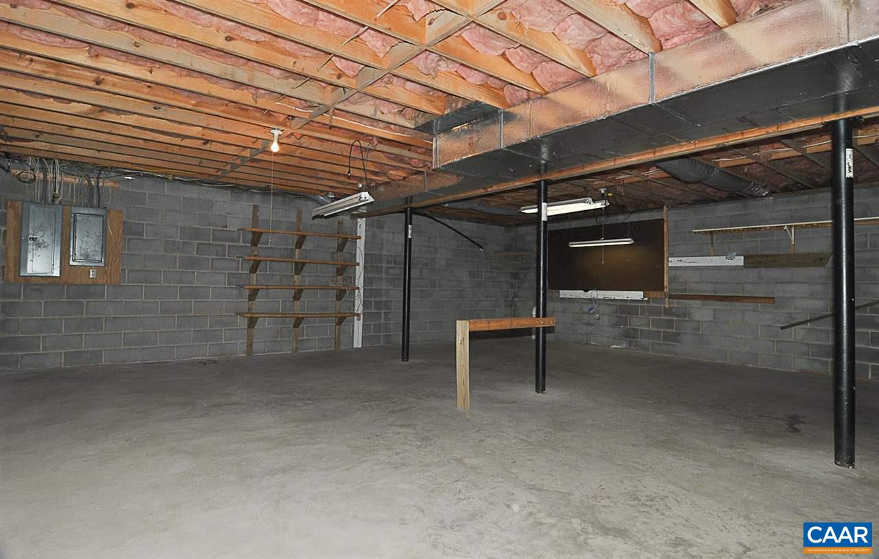 1576 Old Brook Road Charlottesville, VA 22901 - Photo 40 of 42 a view of an empty room with a brick wall