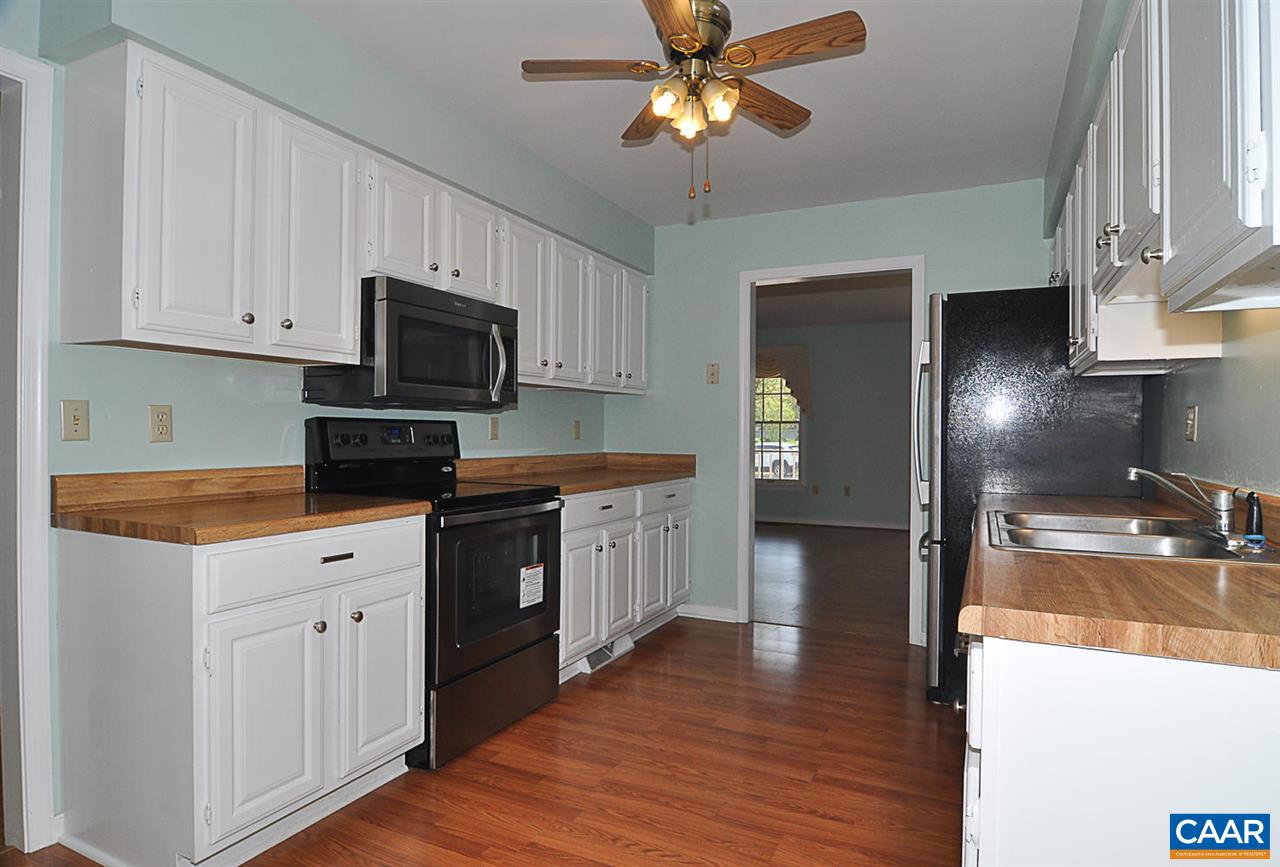 1576 Old Brook Road Charlottesville, VA 22901 - Photo 8 of 42 a kitchen with a stove a sink and a refrigerator