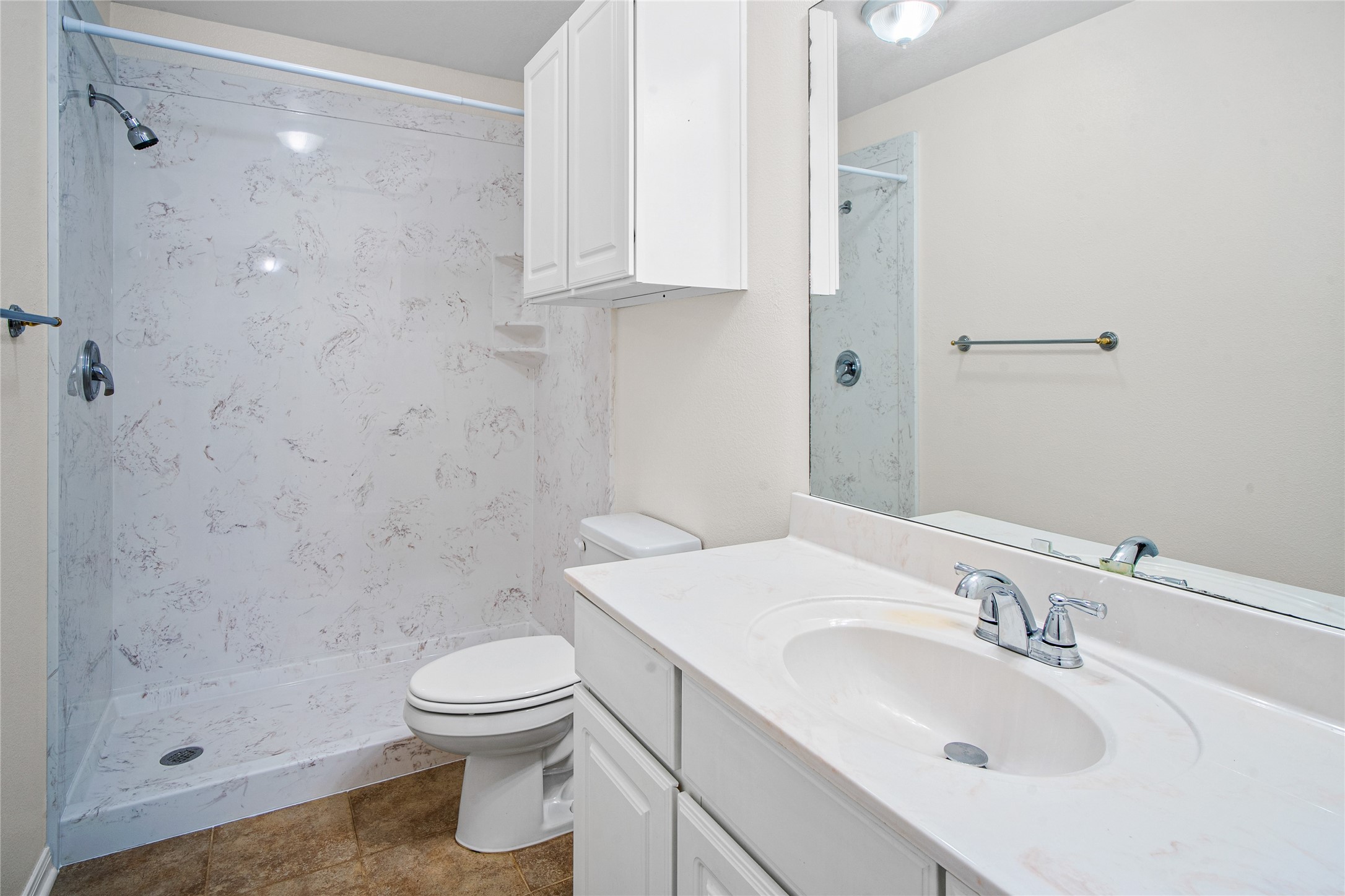 2224 Shady Tree Lane Conroe, TX 77301 - Photo 11 of 20 a bathroom with a sink toilet and shower