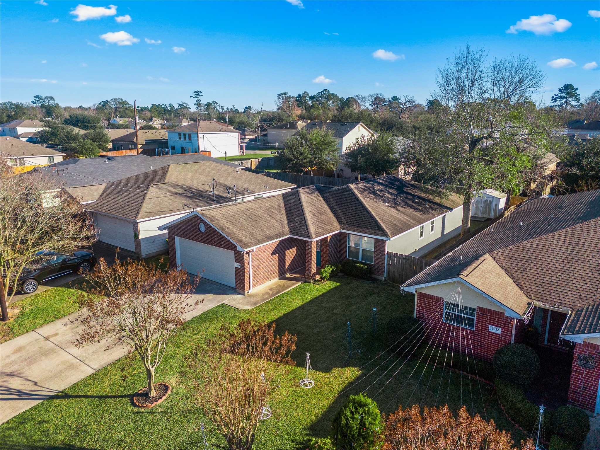 2224 Shady Tree Lane Conroe, TX 77301 - Photo 2 of 20 an aerial view of a house with a garden