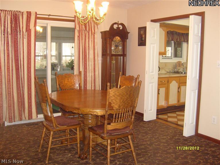 6009 Collins Road Mentor, OH 44060 - Photo 6 of 25 DINING ROOM WITH SLIDERS TO ENCLOSED SUN ROOM