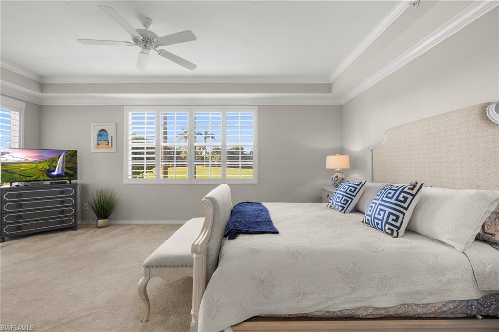 1635 Winding Oaks Way, Unit 101 Naples, FL 34109 - Photo 13 of 37 a bedroom with a bed dresser and a window