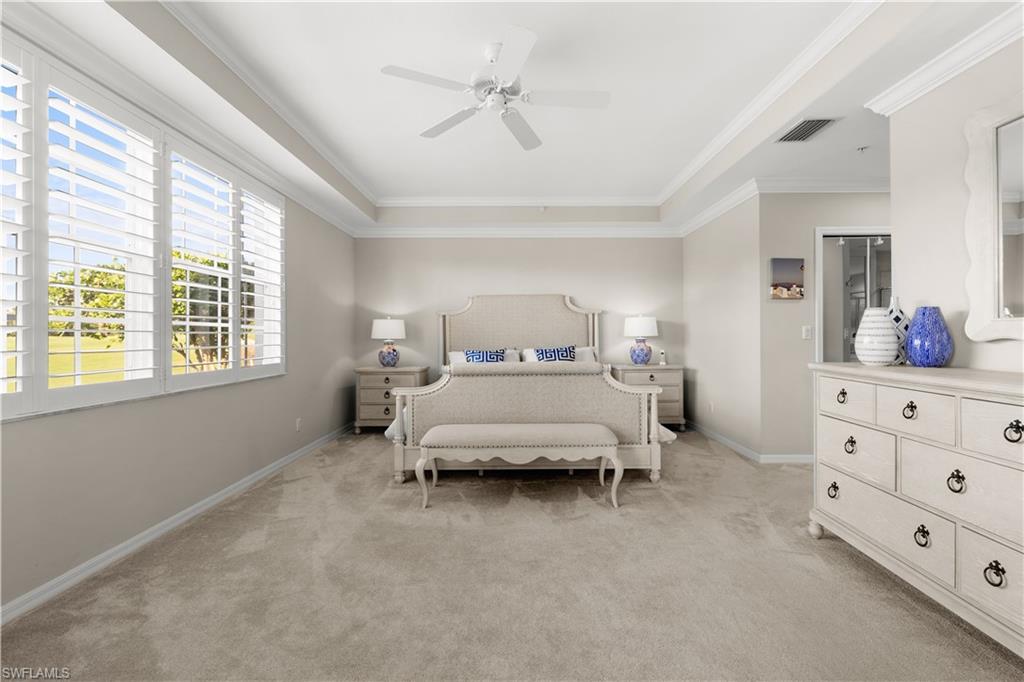 1635 Winding Oaks Way, Unit 101 Naples, FL 34109 - Photo 14 of 37 a bedroom with a bed and window