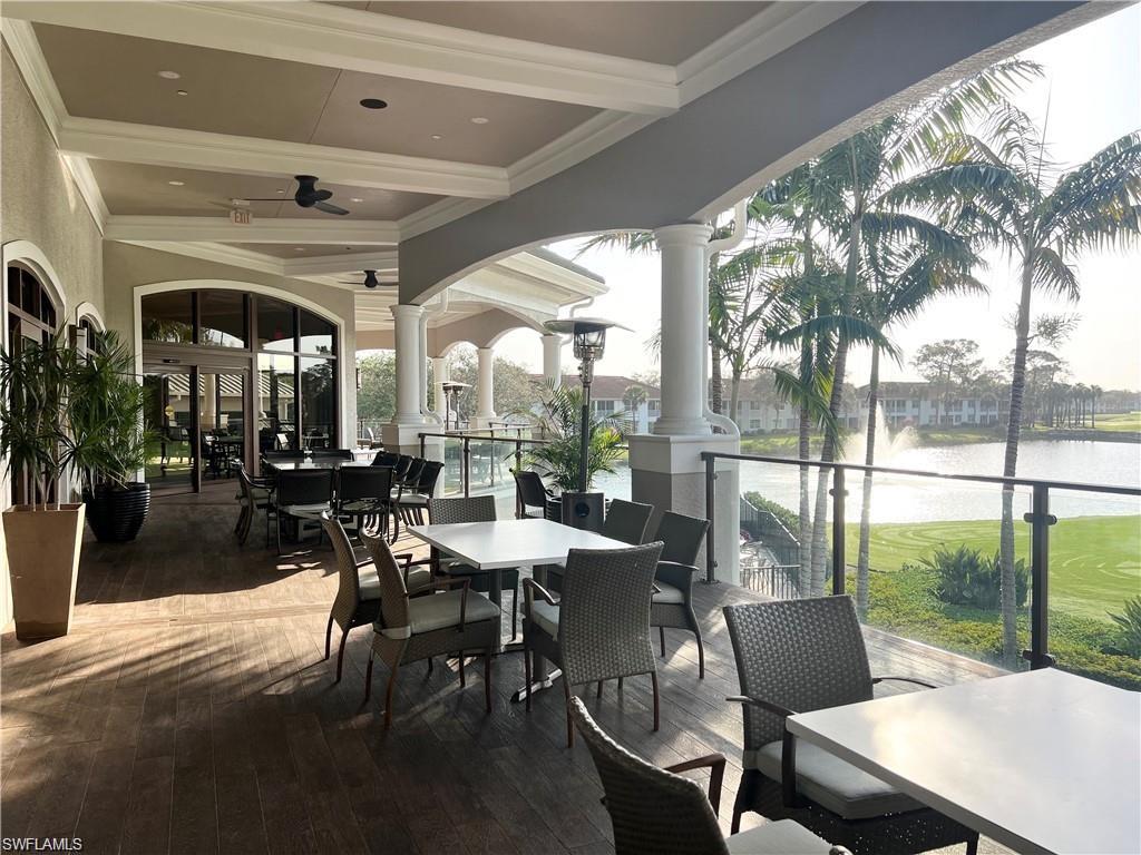 1635 Winding Oaks Way, Unit 101 Naples, FL 34109 - Photo 30 of 37 a outdoor space with lots of furniture and glass windows