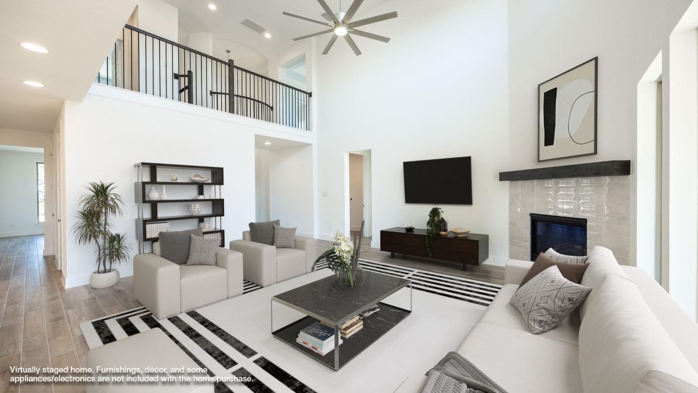 255 Star Rush Trail Georgetown, TX 78633 - Photo 4 of 16 Living room with light wood-style flooring, a fireplace, recessed lighting, a high ceiling, and ceiling fan