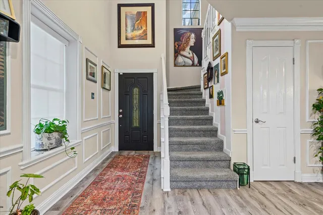 a view of an entryway with wooden floor