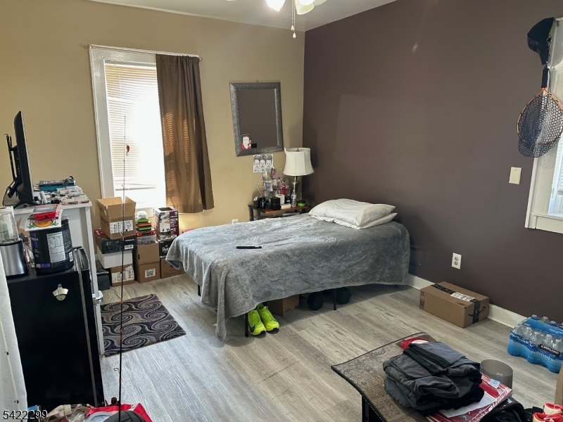 113 Pequannock Street Dover, NJ 07801 - Photo 11 of 17 a bedroom with a bed and a dresser