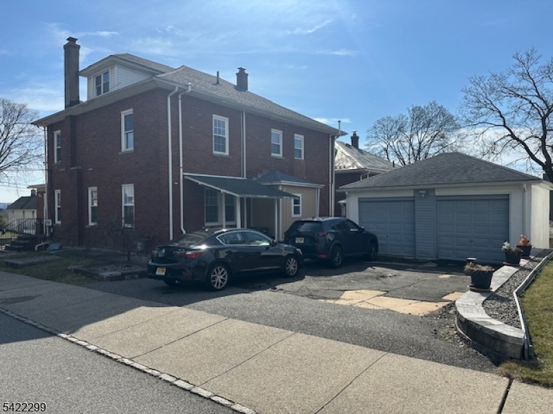 113 Pequannock Street Dover, NJ 07801 - Photo 2 of 17 a front view of a house with a garden