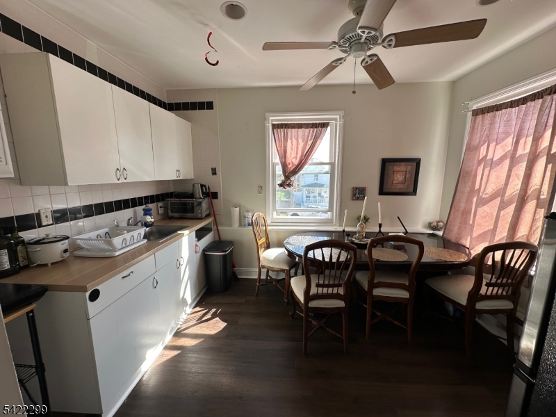 113 Pequannock Street Dover, NJ 07801 - Photo 3 of 17 a view of a dining room with furniture and window