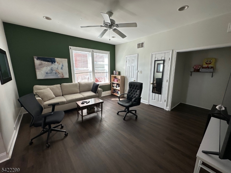 113 Pequannock Street Dover, NJ 07801 - Photo 5 of 17 a living room with furniture a window and a flat screen tv