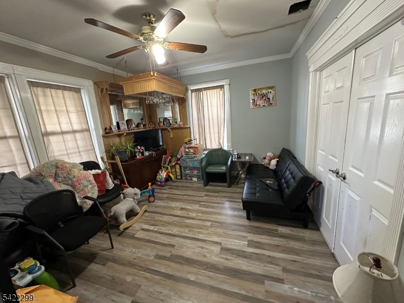 113 Pequannock Street Dover, NJ 07801 - Photo 9 of 17 a living room with furniture and a fireplace