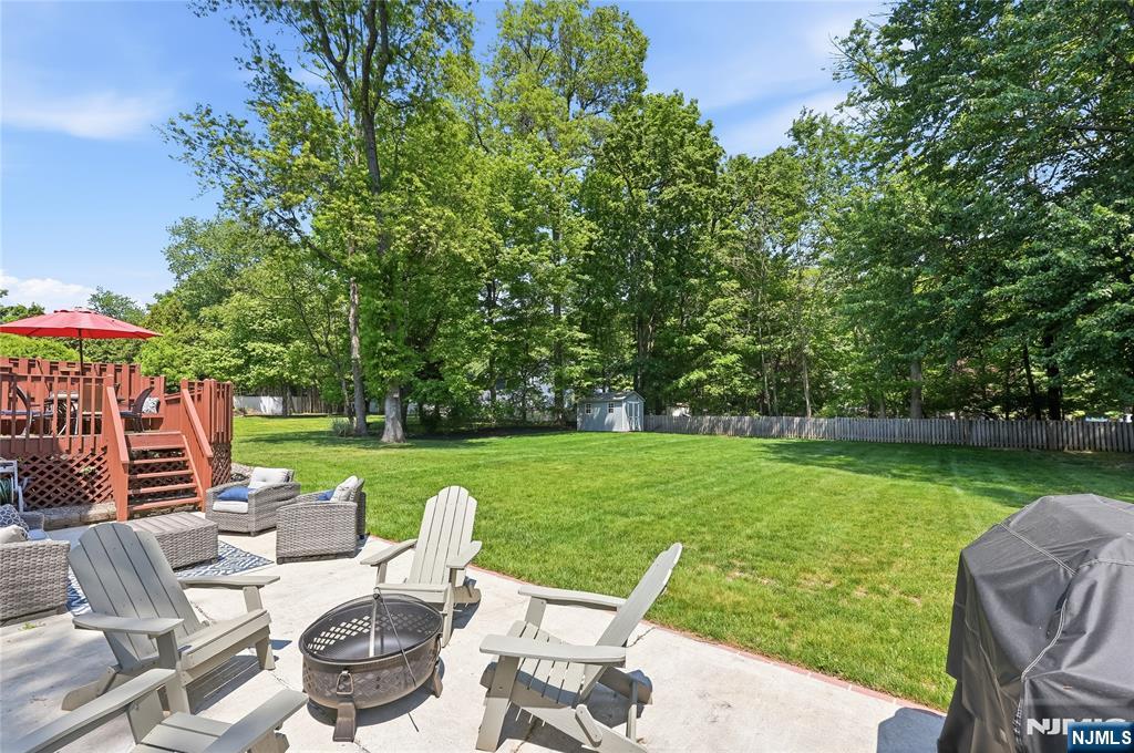 77 White Pond Road Waldwick, NJ 07463 - Photo 30 of 33 a view of a patio with couches chairs and a yard
