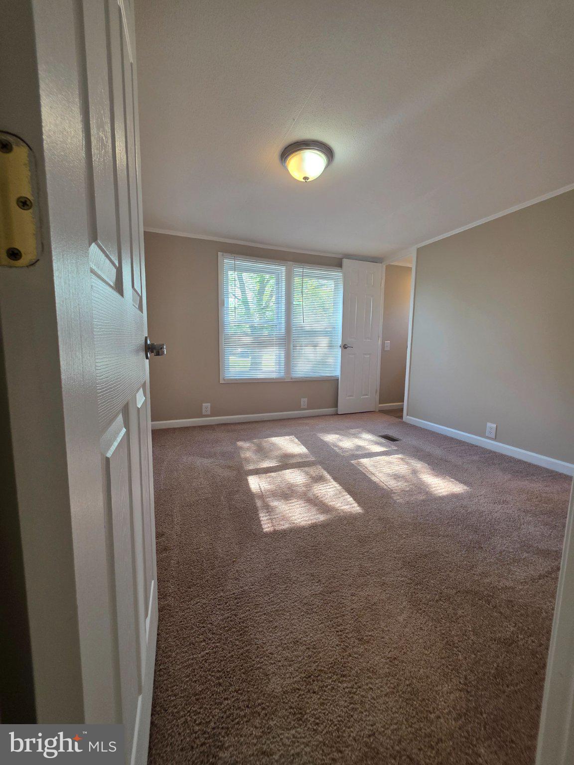 150 West Street Magnolia, DE 19962 - Photo 12 of 26 Bright and inviting room with sunlight.