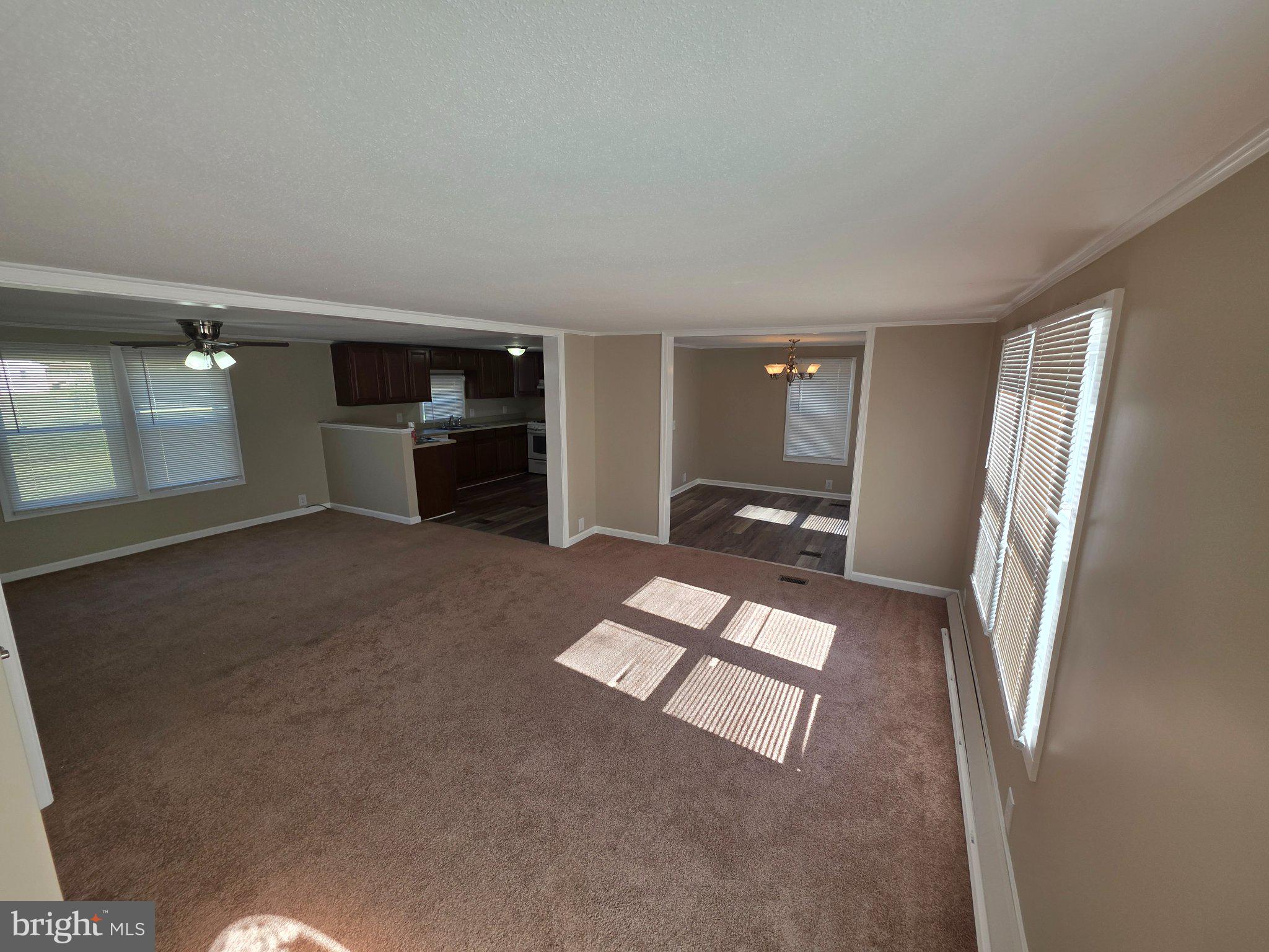 150 West Street Magnolia, DE 19962 - Photo 3 of 26 Spacious, sunlit living area awaits you.