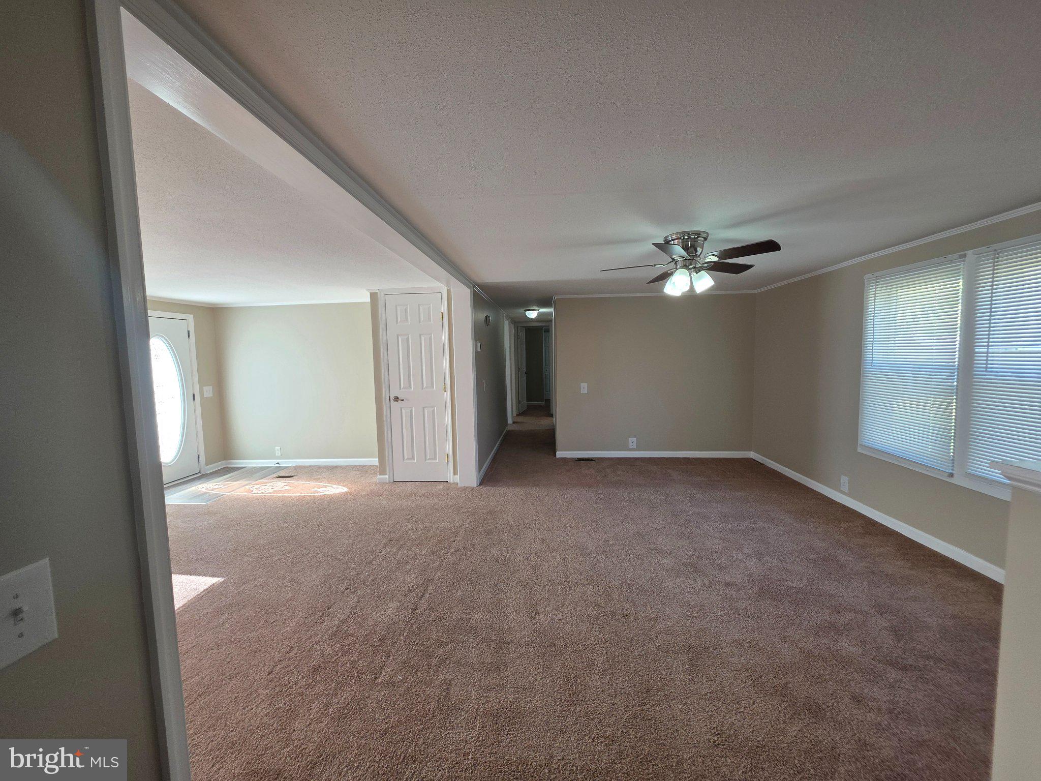 150 West Street Magnolia, DE 19962 - Photo 7 of 26 Spacious, sunlit living area awaits you.