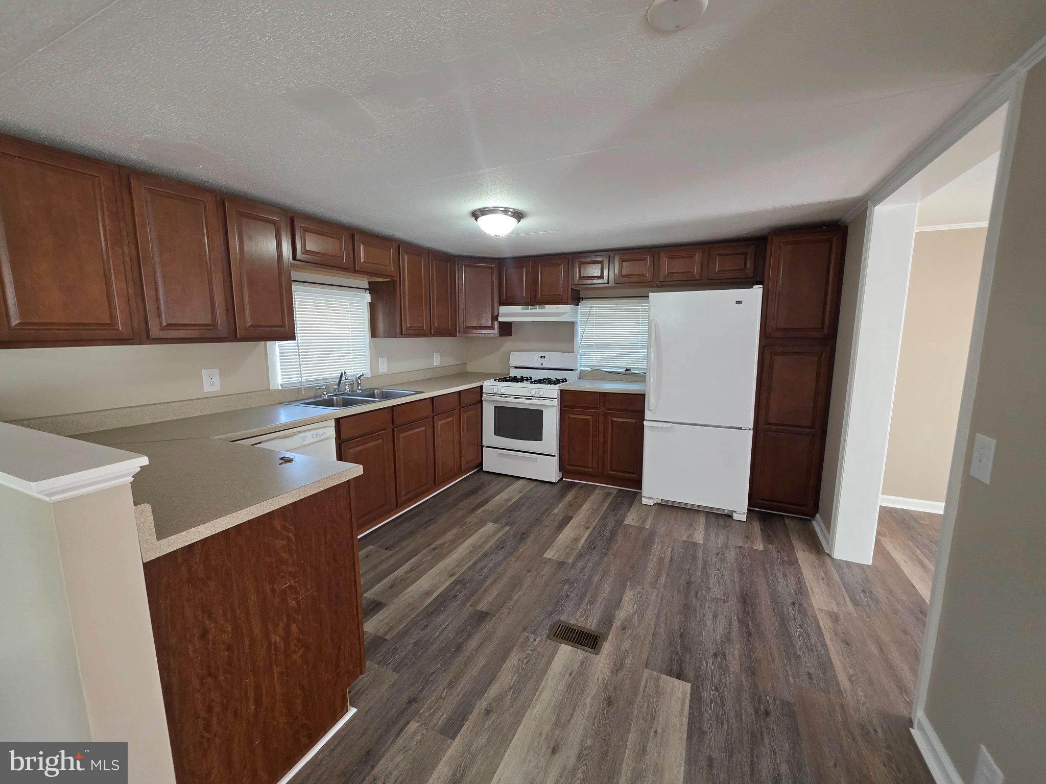 150 West Street Magnolia, DE 19962 - Photo 8 of 26 Modern kitchen with warm wood tones.