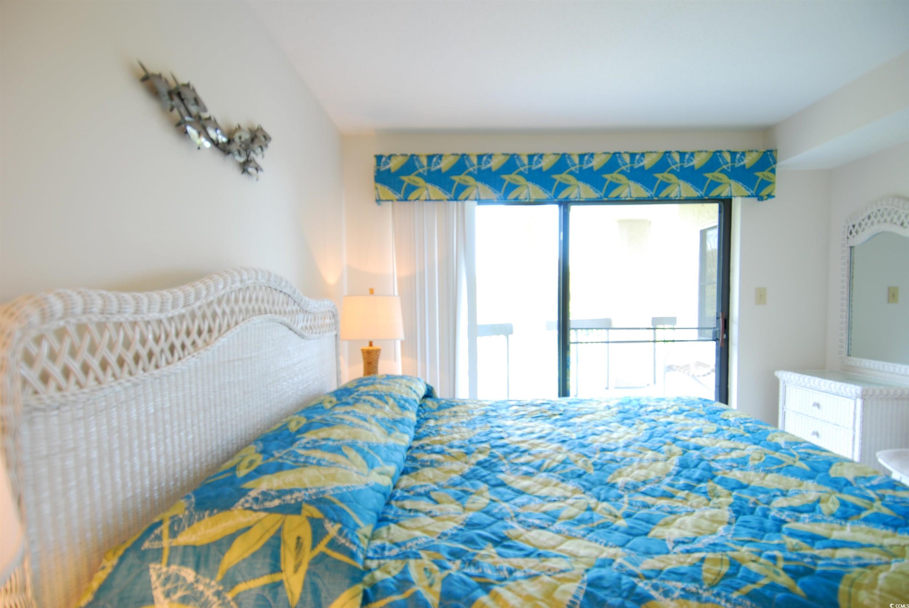 200 Lands End Boulevard, Unit 2015 Myrtle Beach, SC 29572 - Photo 14 of 28 Bedroom featuring access to exterior
