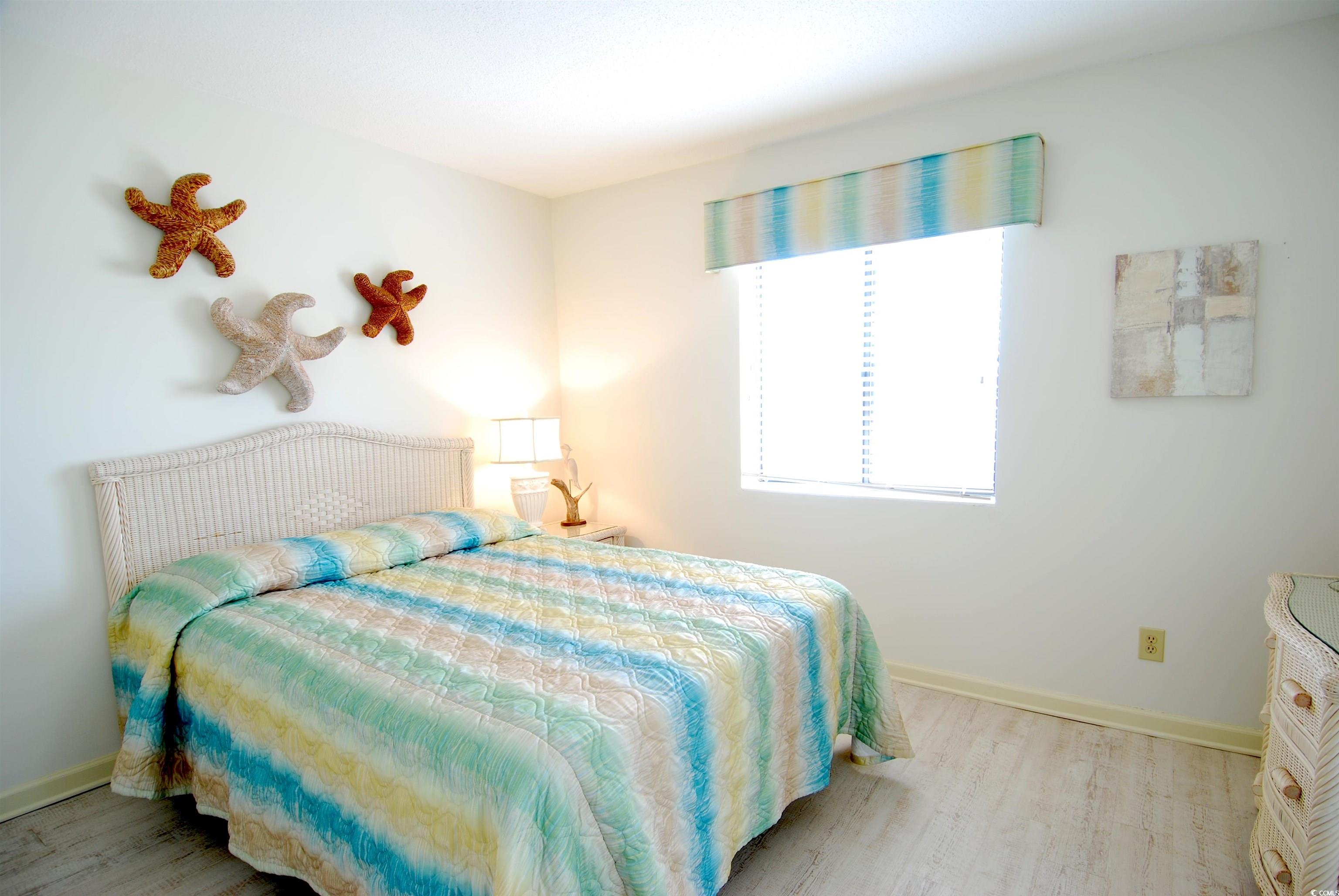 200 Lands End Boulevard, Unit 2015 Myrtle Beach, SC 29572 - Photo 17 of 28 Bedroom with wood-type flooring