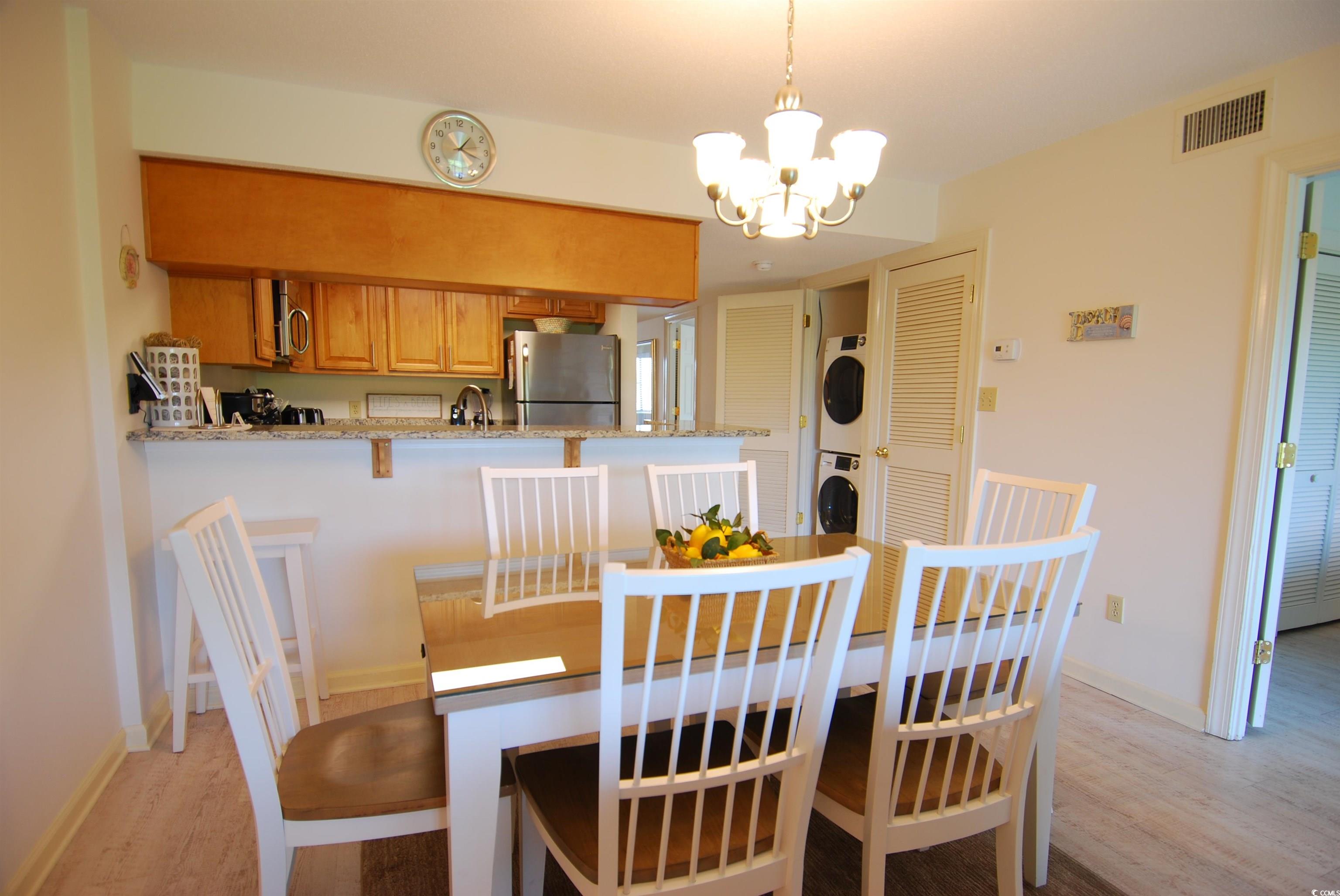 200 Lands End Boulevard, Unit 2015 Myrtle Beach, SC 29572 - Photo 6 of 28 Dining area featuring a notable chandelier, sink,