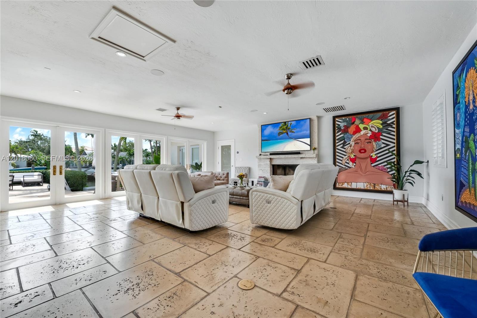 13035 Nevada Street Coral Gables, FL 33156 - Photo 12 of 21 a living room with fireplace furniture and a rug