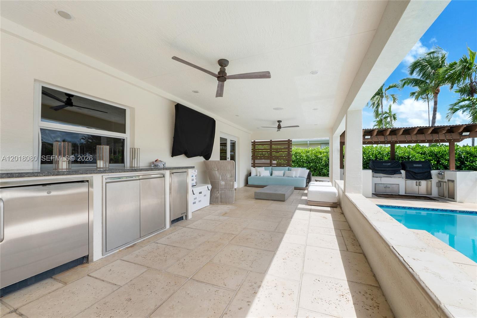 13035 Nevada Street Coral Gables, FL 33156 - Photo 13 of 21 a view of living room kitchen with furniture and flat screen tv