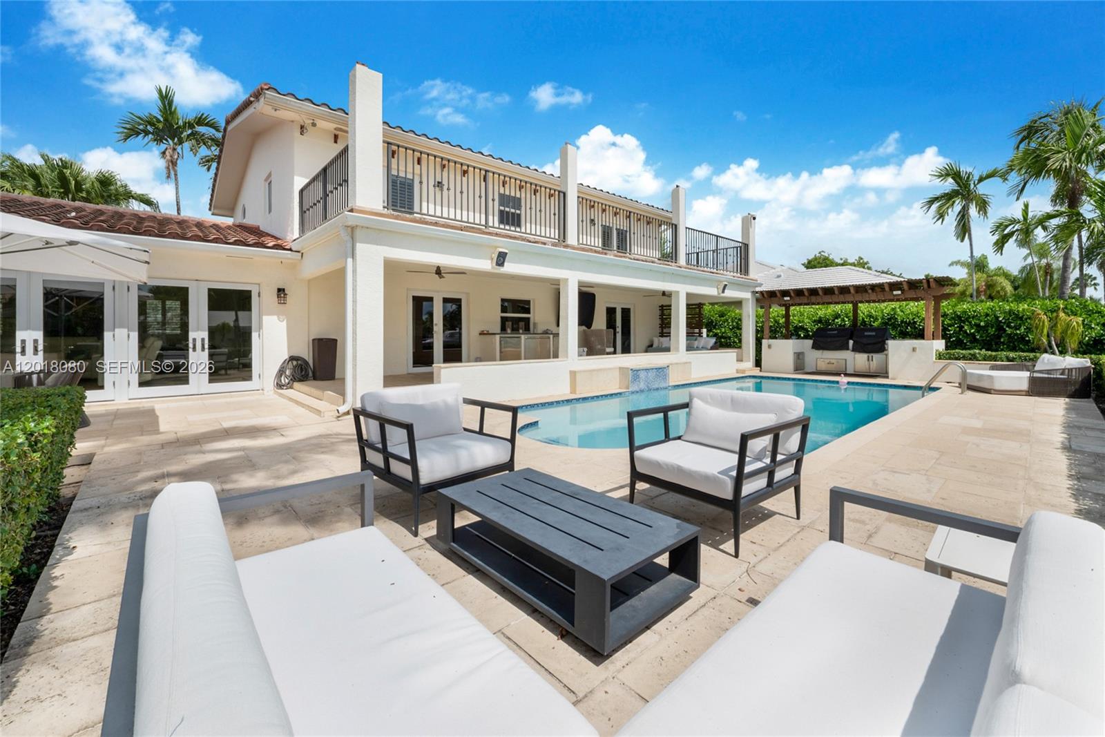 13035 Nevada Street Coral Gables, FL 33156 - Photo 15 of 21 a view of a patio with couches table and chairs and potted plants