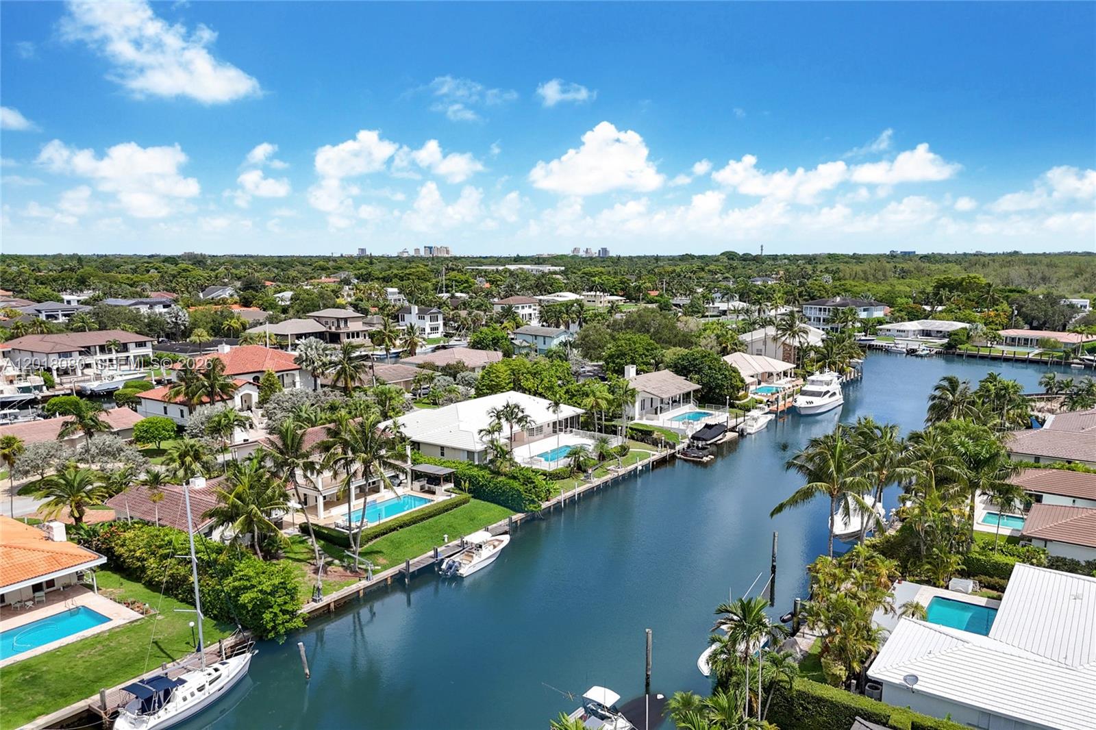 13035 Nevada Street Coral Gables, FL 33156 - Photo 18 of 21 an aerial view of a city with lots of residential buildings lake and ocean view