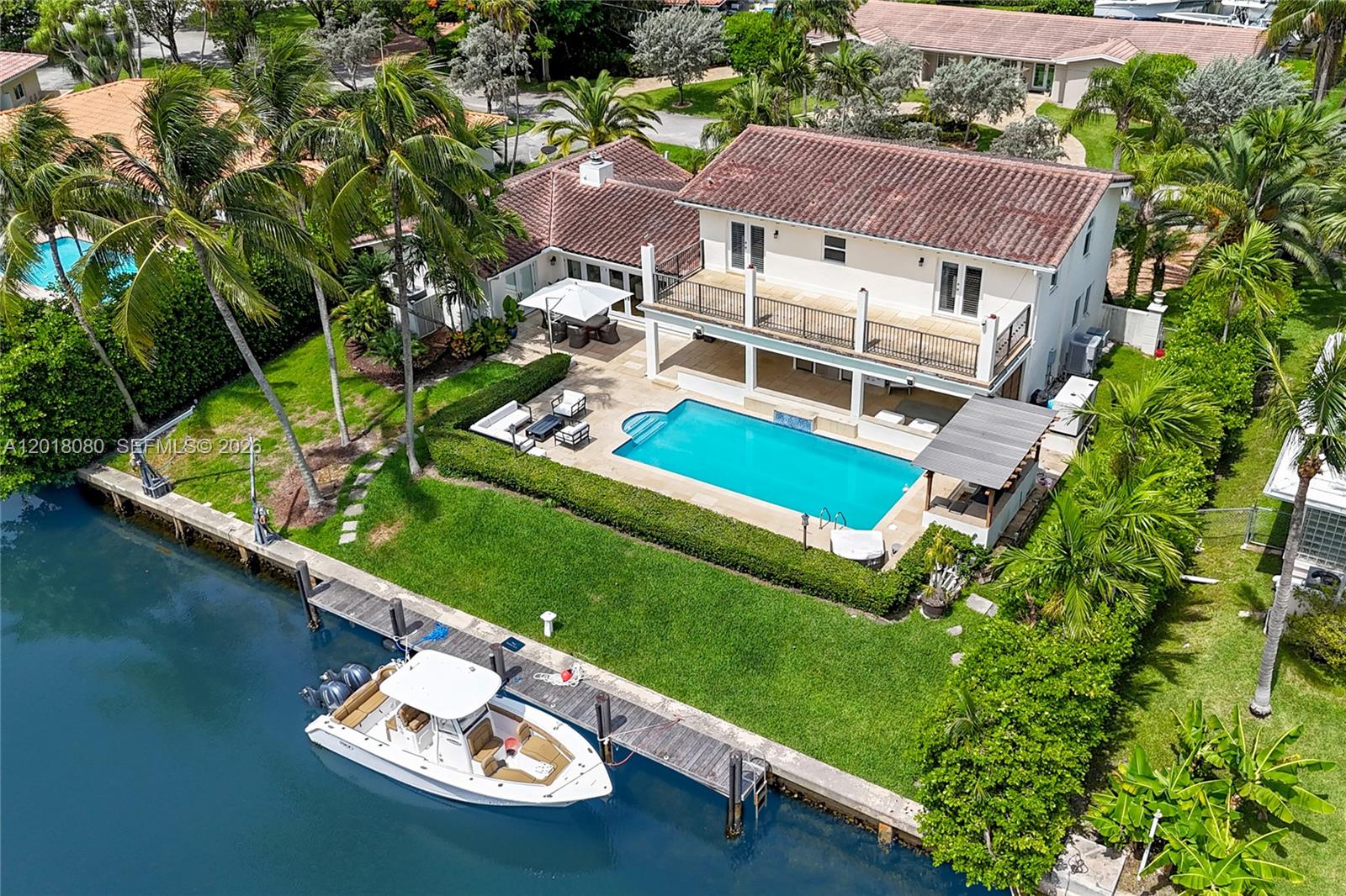 13035 Nevada Street Coral Gables, FL 33156 - Photo 20 of 21 an aerial view of a house with a garden and lake view