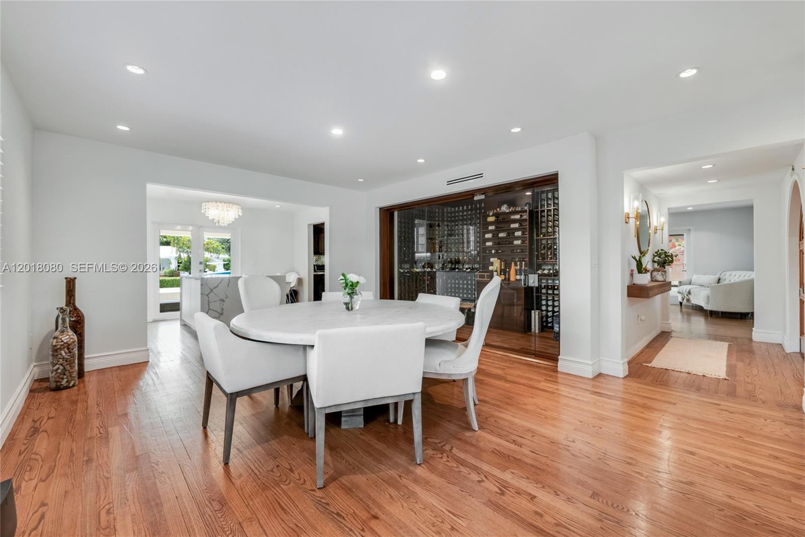 13035 Nevada Street Coral Gables, FL 33156 - Photo 3 of 21 a view of a dining room with furniture and wooden floor