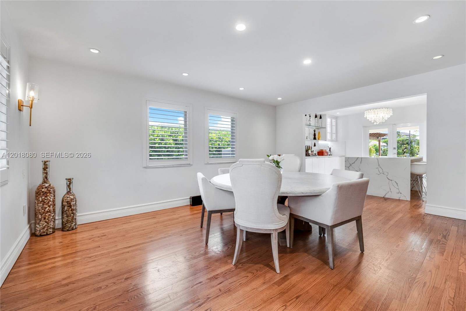 13035 Nevada Street Coral Gables, FL 33156 - Photo 4 of 21 a view of a dining room with furniture and wooden floor