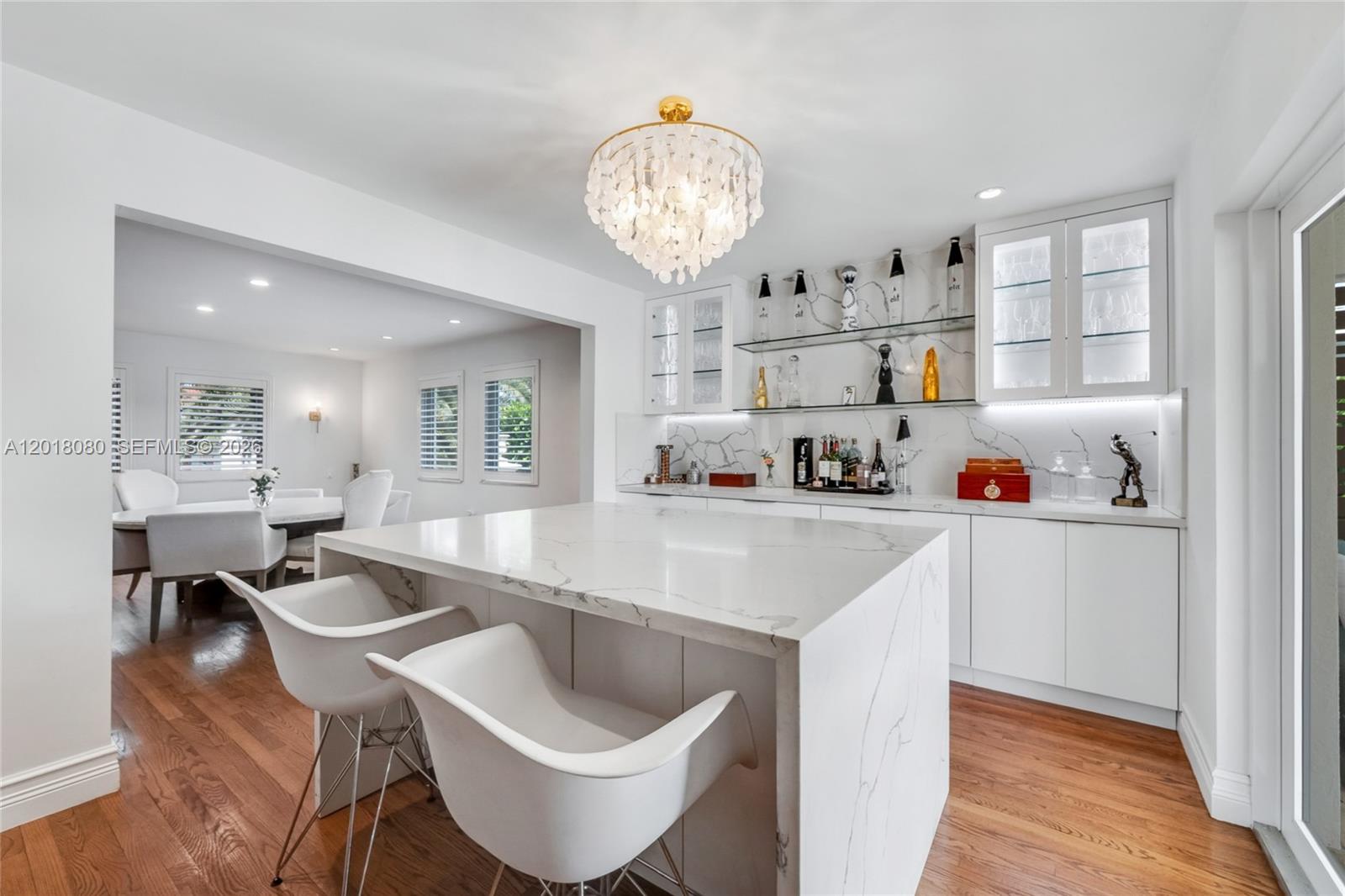 13035 Nevada Street Coral Gables, FL 33156 - Photo 6 of 21 a kitchen with stainless steel appliances granite countertop a sink and a refrigerator