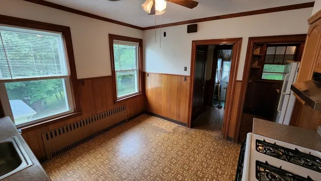 a view of a hallway with windows