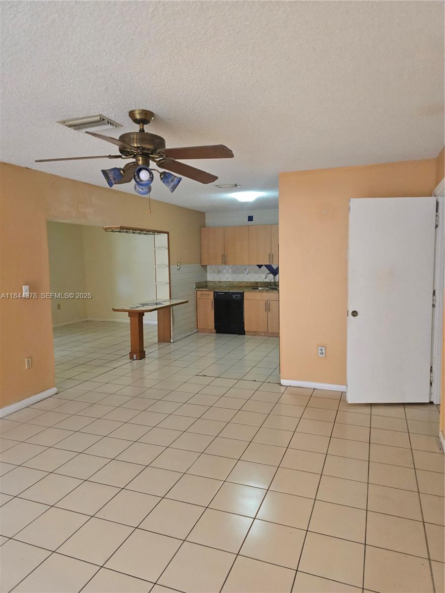 13748 Southwest 155th Terrace Miami, FL 33177 - Photo 4 of 12 a view of an empty room and window