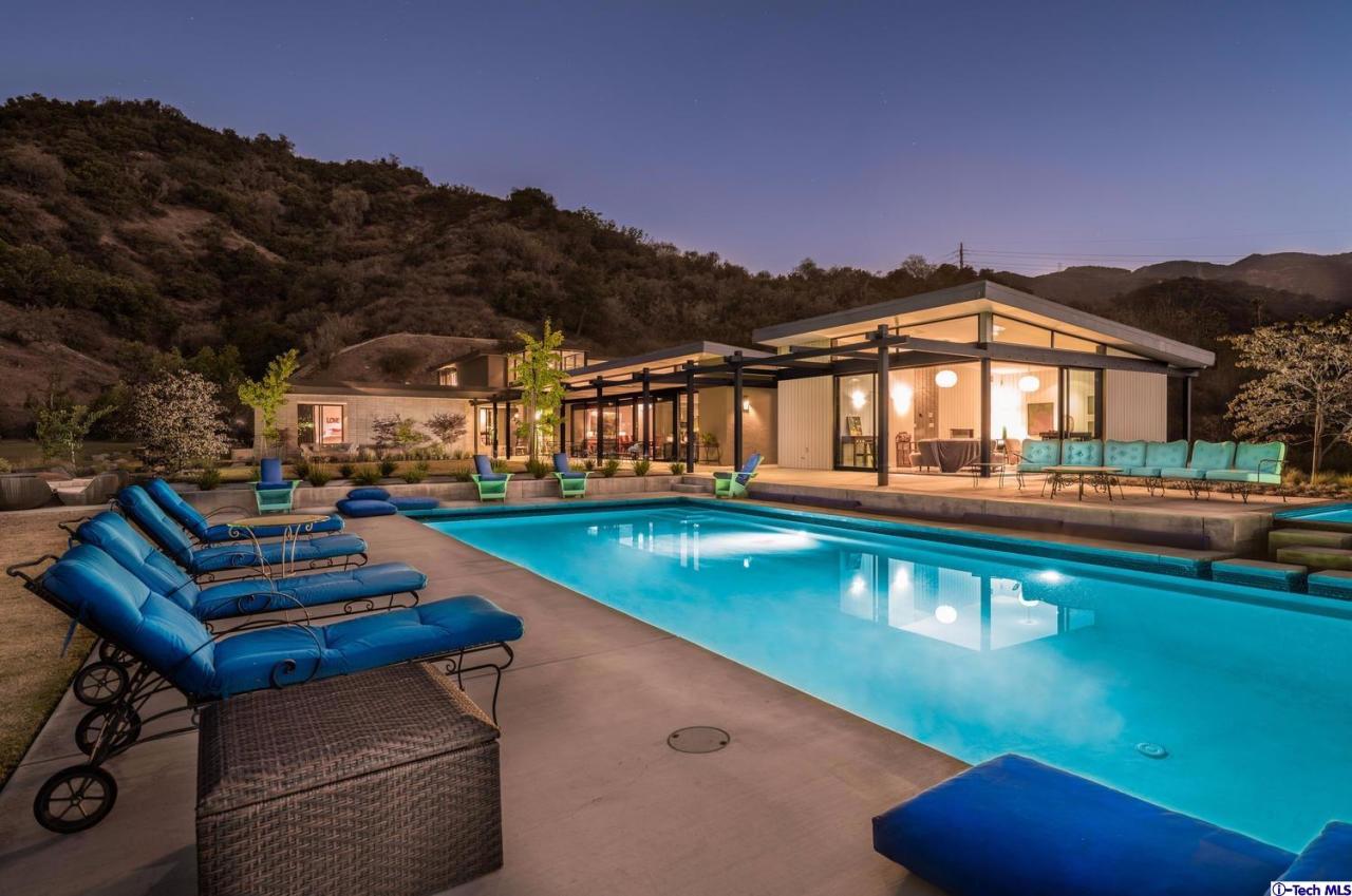 a view of an chairs and table in a patio