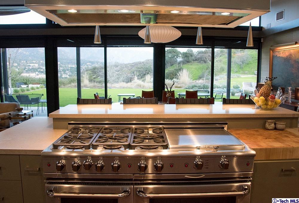 3645 Deerpass Road Glendale, CA 91208 - Photo 14 of 39 a stove sitting next to a large window