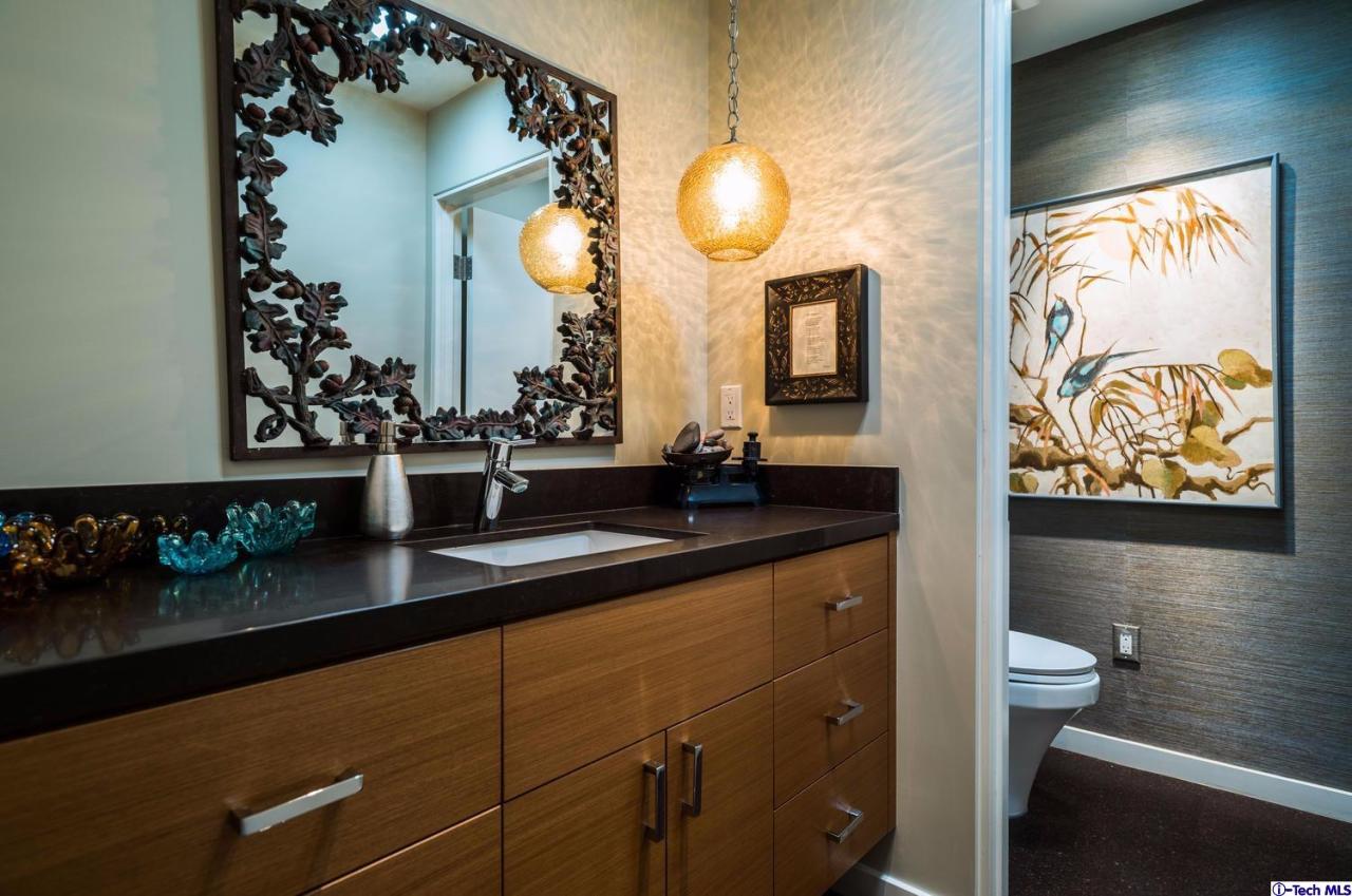 3645 Deerpass Road Glendale, CA 91208 - Photo 18 of 39 a bathroom with a sink mirror and vanity