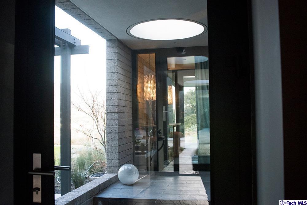3645 Deerpass Road Glendale, CA 91208 - Photo 19 of 39 a bathroom with a glass shower door