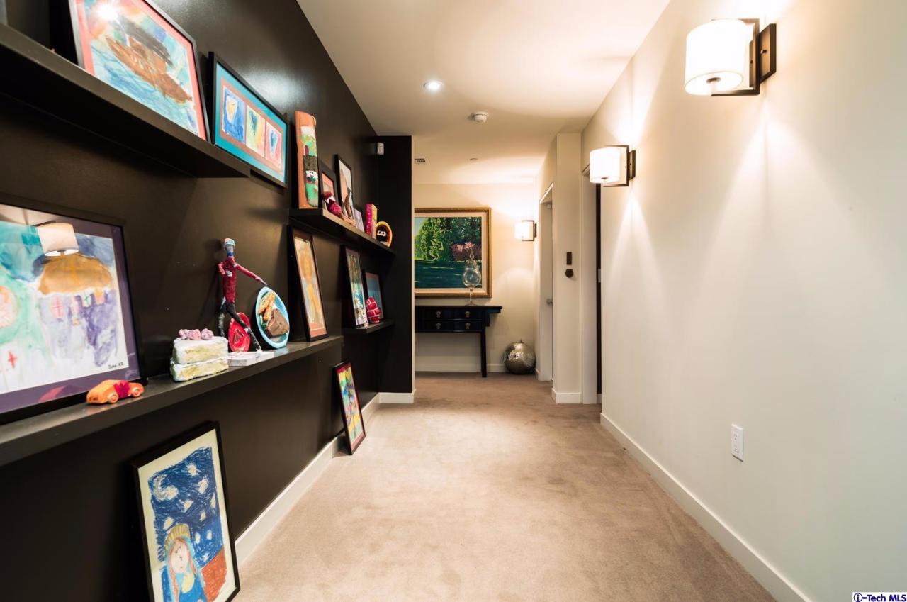 3645 Deerpass Road Glendale, CA 91208 - Photo 21 of 39 a view of a hallway with a lots of frames on wall