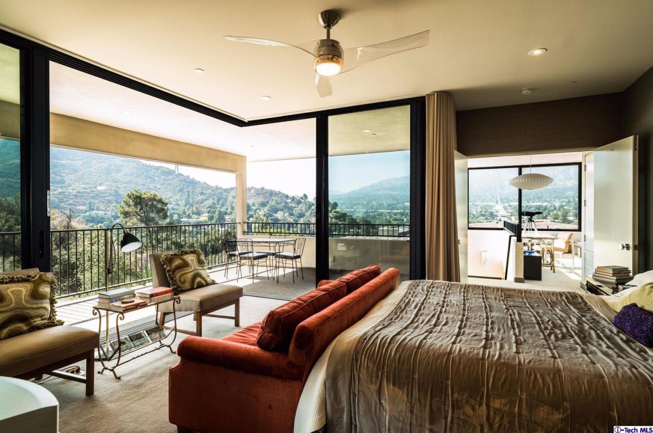 3645 Deerpass Road Glendale, CA 91208 - Photo 25 of 39 a bedroom with a bed and a large window