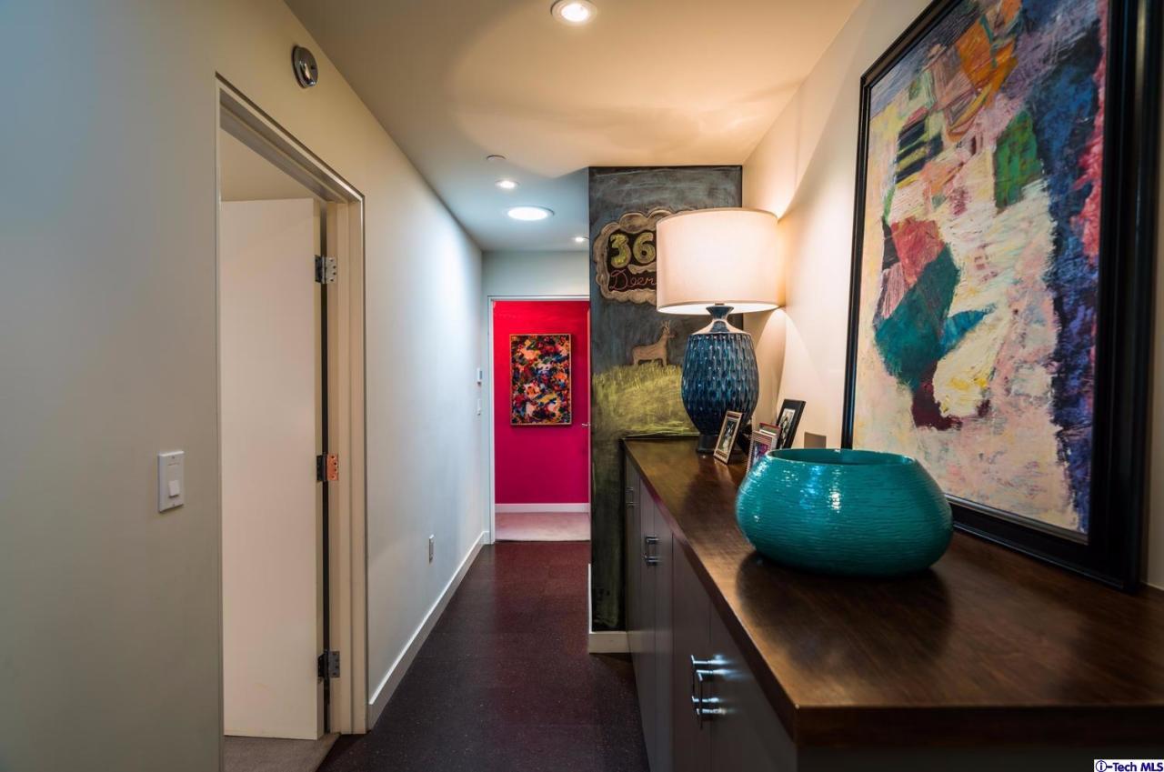 3645 Deerpass Road Glendale, CA 91208 - Photo 28 of 39 a living room with furniture and a mirror
