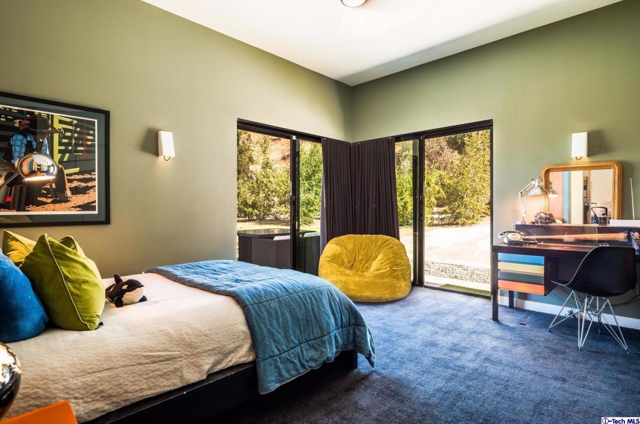 3645 Deerpass Road Glendale, CA 91208 - Photo 32 of 39 a bedroom with a bed chair and a window