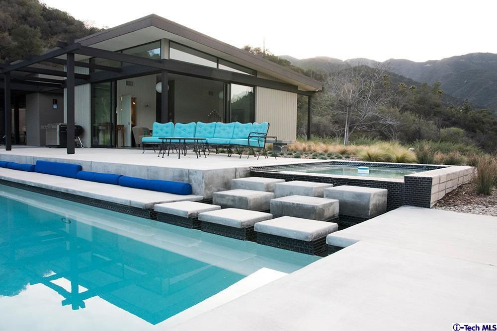 3645 Deerpass Road Glendale, CA 91208 - Photo 38 of 39 a view of a house with swimming pool and sitting area