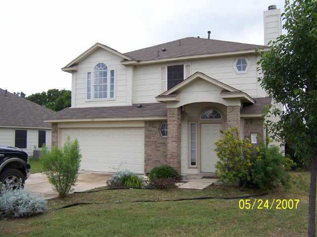 1817 Greening Way Leander, TX 78641 - Photo 1 of 1 a front view of a house with a yard and garage