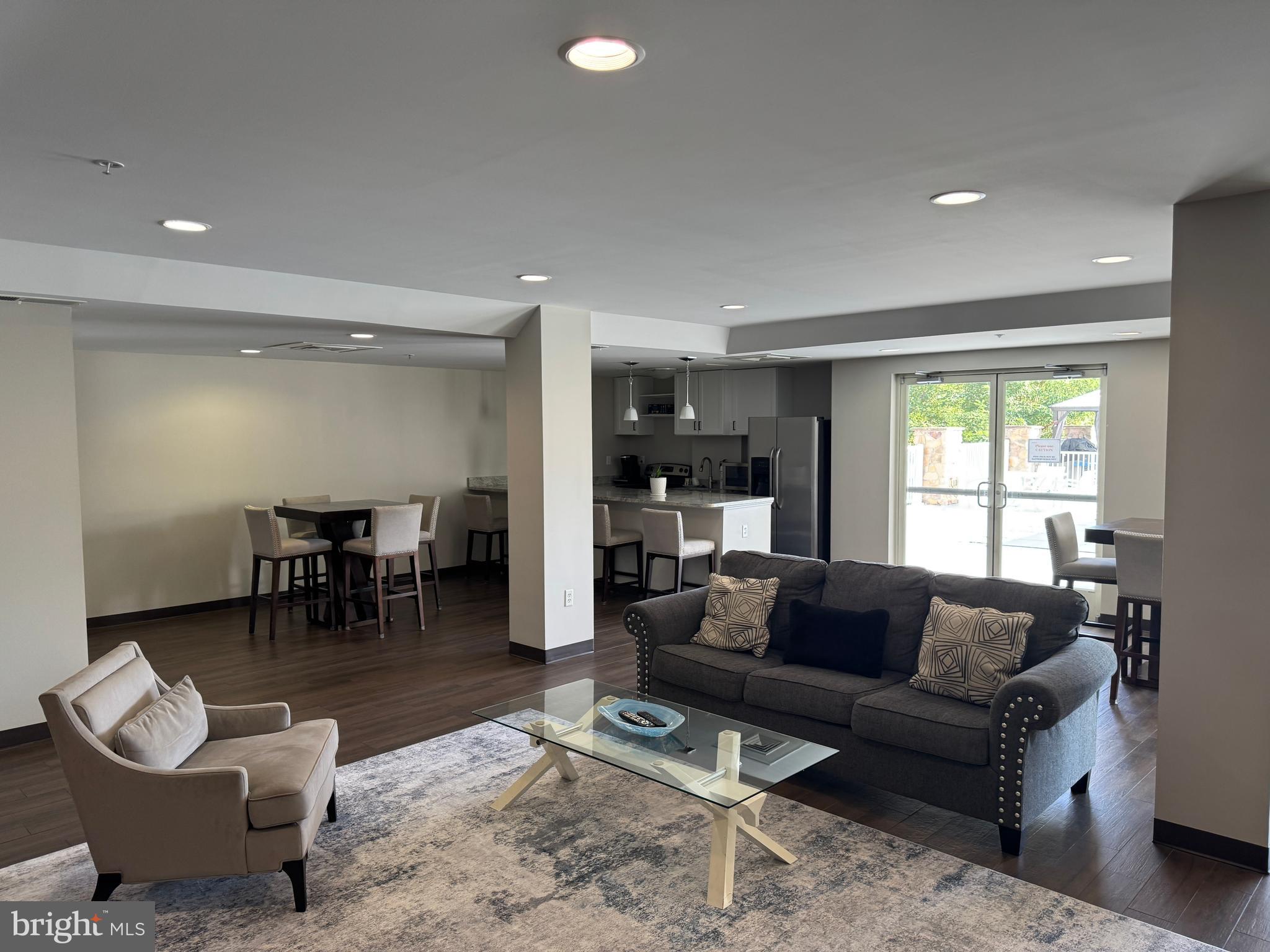 6301 Edsall Road, Unit 102 Alexandria, VA 22312 - Photo 20 of 24 a living room with furniture and a large window